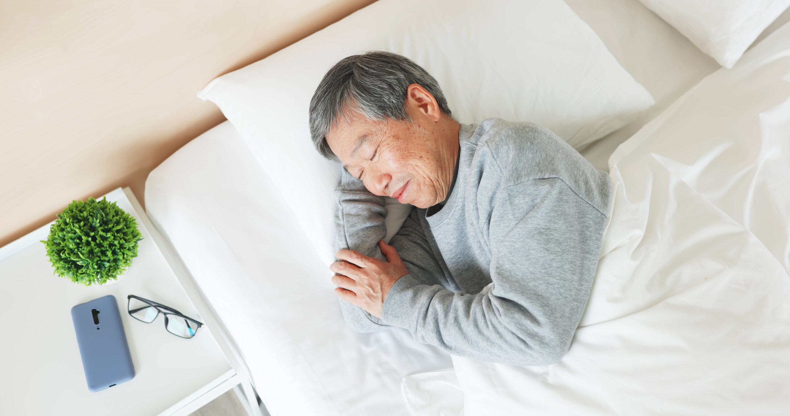 Top,View,Of,Asian,Senior,Man,Lying,On,Bed,Sleep